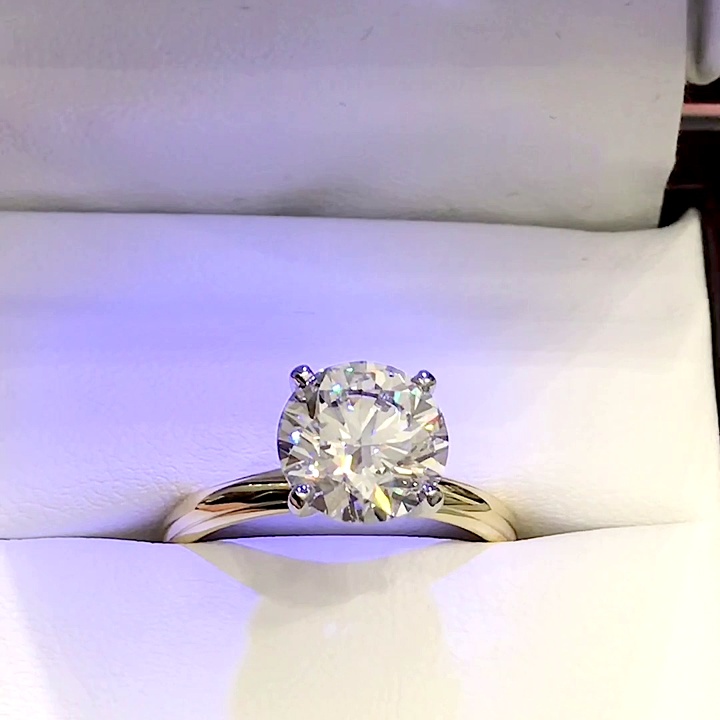18kt Yellow Gold and Platinum Engagement Ring with 3 carat lab diamond at the center (Color: E | Clarity: VS1 | Round Cut). Solitaire Setting with Platinum Head.